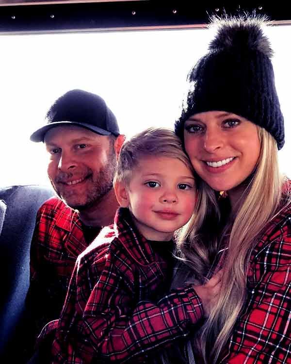 Image of Paul Teutul Jr. with his wife Rachael Biester and with their son