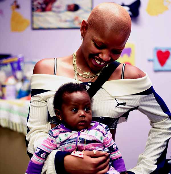 Image of Slick Woods with her son Saphir