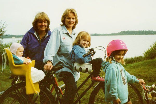 Image of  Sandi with her former partner, Peta Stewart, and three kids