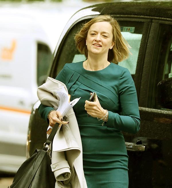 Image of Laura Kuenssberg Flaunting her Blue dress, An SUV and An I-phone