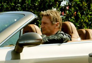 Image of Liam Neeson in his Bentley car.